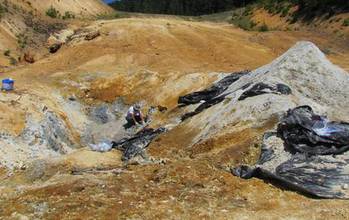 Open pit near Crater Lake, Oregon, showing blue clay sampled by scientist Keith Morrison.